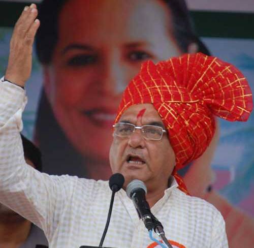 Hooda votes in village with mother