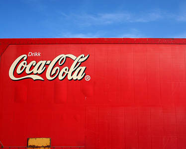 Soft-drink volume up, profits down at Coca-Cola