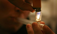 An addict smoking crack cocaine