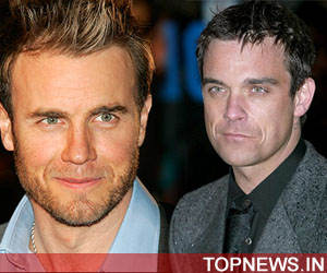 Gary Barlow wants Robbie Williams to rejoin Take That