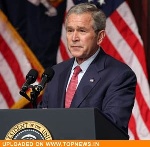Unpopular Bush keeps low profile as McCain seeks distance