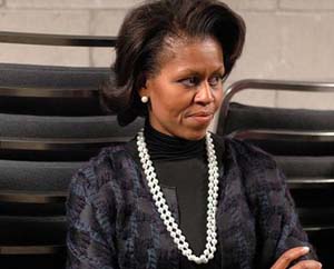 Michelle Obama’s satin dress with plunging neckline, high slit in prom date pic