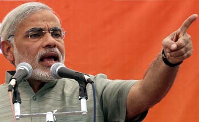 Fearing shoe-attack, Modi addresses rally surrounded by a net