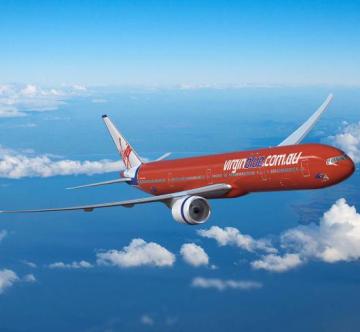 Virgin Blue lowers its full year earnings guidance, shares fall