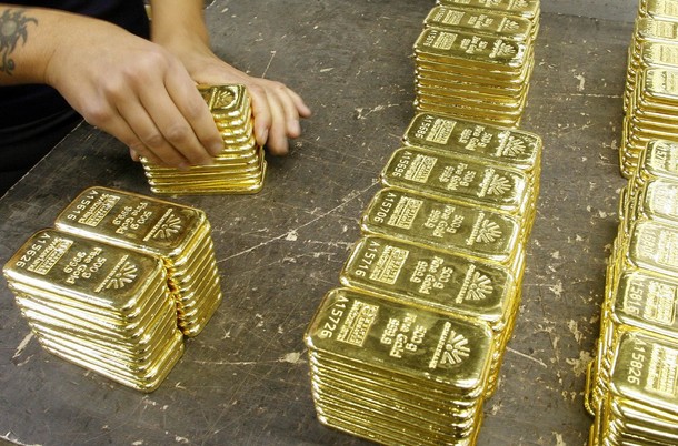 gold-bars Gold futures rose above $970 an ounce on Tuesday, 