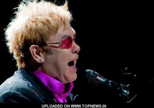 Elton John postpones US gigs due to "serious case" of E-coli, flu