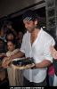 Bollywood actor Hrithik Roshan poses with his birthday cake as he celebrates his 38th anniversary in Mumbai