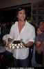 Bollywood actor Hrithik Roshan poses with his birthday cake as he celebrates his 38th anniversary in Mumbai