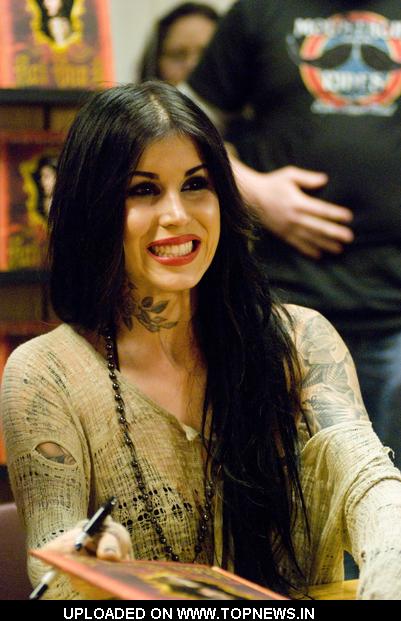 Kat Von D at Tattoo Artist Kat Von D Signs Copies of "High voltage Tattoo