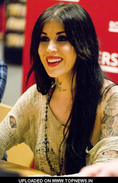 Kat Von D at Tattoo Artist Kat Von D Signs Copies of "High voltage Tattoo