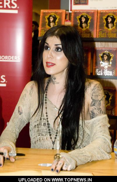 Kat Von D at Tattoo Artist Kat Von D Signs Copies of High voltage Tattoo