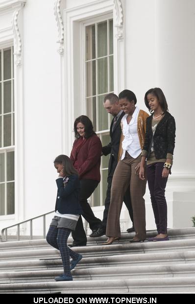 Michelle Obama with Daughters Malia and Sasha Receive the White House Christmas Tree on November 26, 2010 Michelle Obama with Daughters Malia and Sasha Receive the White House Christmas Tree on November 26, 2010