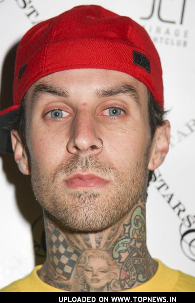 Travis Barker at Famous Stars and Straps Magic Party with Special Appearance