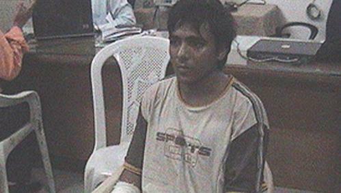 Kasab reading Gandhi’s autobiography in jail