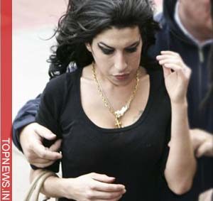 Winehouse escapes assault probe after throwing water glass at a woman