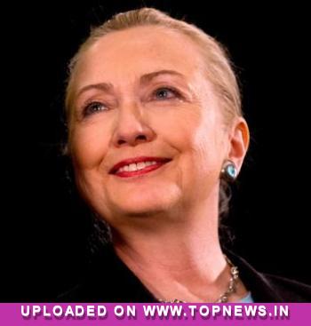 Back on job, Clinton presented with football helmet to ward off further concussions! 