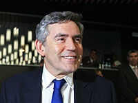 Brown comes out smiling from "crunch summit"
