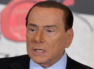 Topless women target Berlusconi as he votes in election 