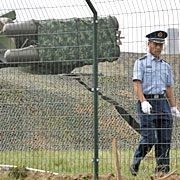 Chinese guards, farmers train their guns on clouds to ensure dry Olympics