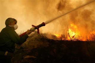 Firefighters make progress ahead of hotter weather