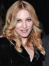 Madonna sues for millions over "secret" wedding photos 