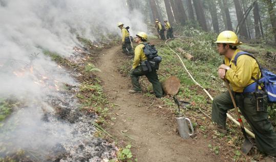 In blazing temperatures crews gain on fire